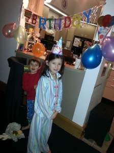 Never too early for balloons and a party hat